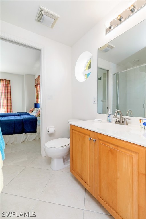 2797 First Street, Unit 1806 Fort Myers, FL 33916 - Photo 18 of 34 a bathroom with a sink a toilet and a mirror