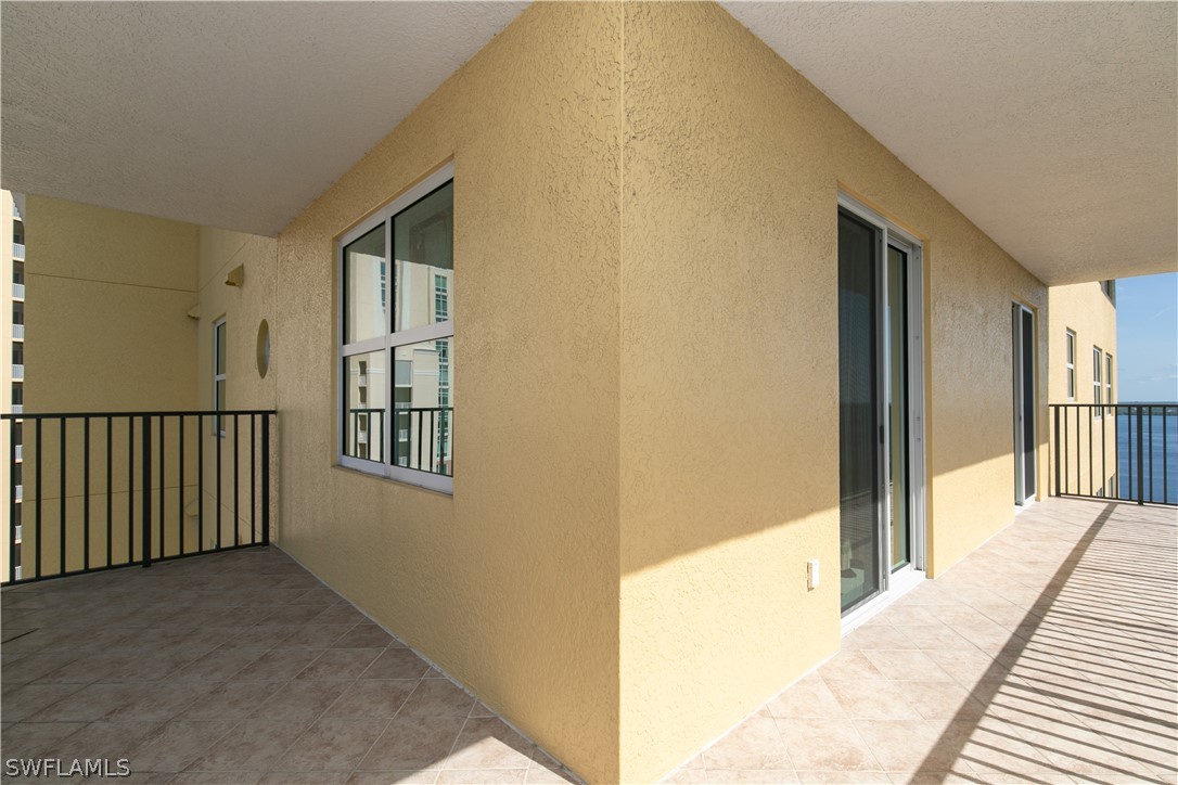 2797 First Street, Unit 1806 Fort Myers, FL 33916 - Photo 24 of 34 a view of a hallway with wooden floor and entryway