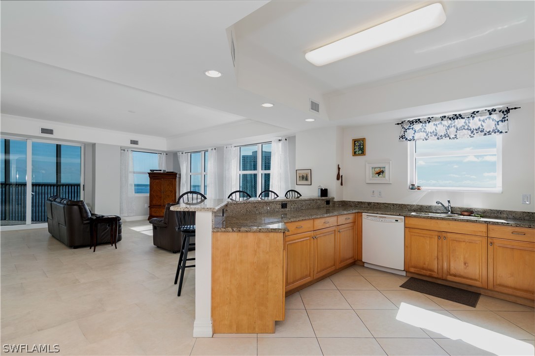 2797 First Street, Unit 1806 Fort Myers, FL 33916 - Photo 4 of 34 a kitchen with stainless steel appliances granite countertop a sink and cabinets