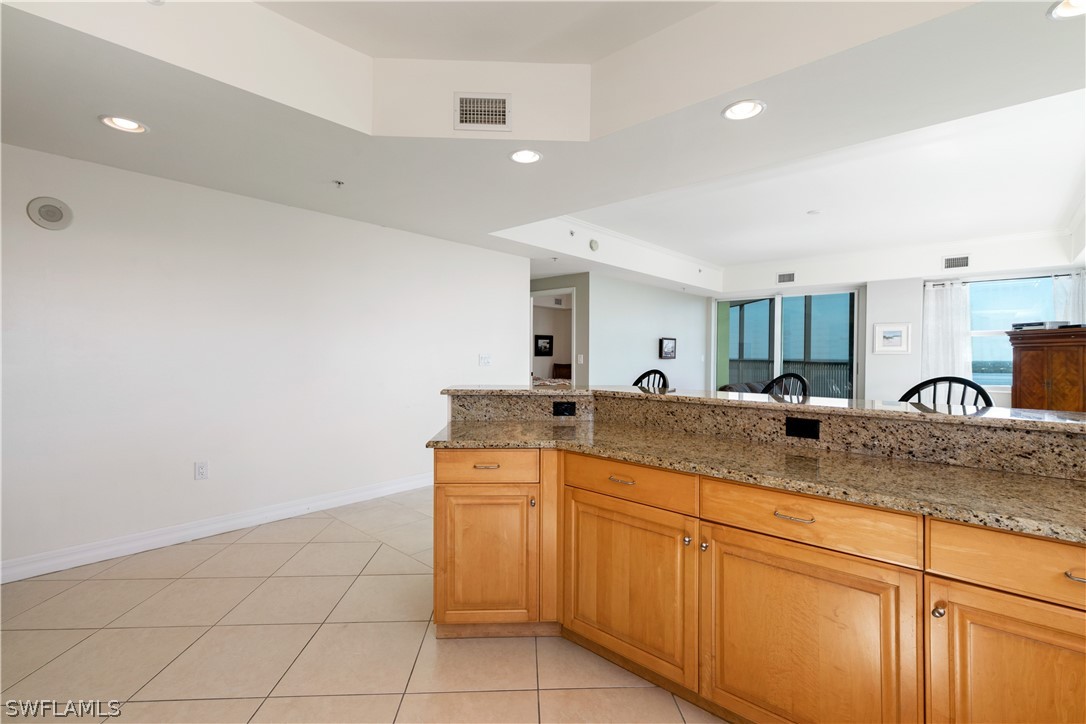 2797 First Street, Unit 1806 Fort Myers, FL 33916 - Photo 9 of 34 a kitchen with a sink and cabinets