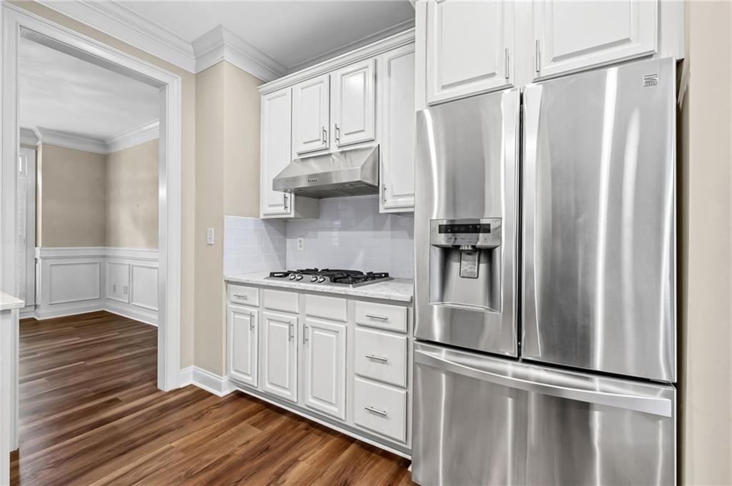 589 Lawton Bridge Road Southwest Smyrna, GA 30082 - Photo 16 of 52 a kitchen with stainless steel appliances a refrigerator and a stove top oven