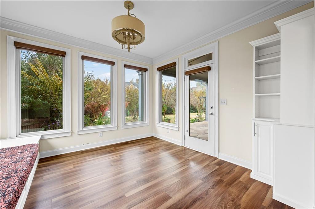 589 Lawton Bridge Road Southwest Smyrna, GA 30082 - Photo 20 of 52 a view of an empty room with a window and wooden floor