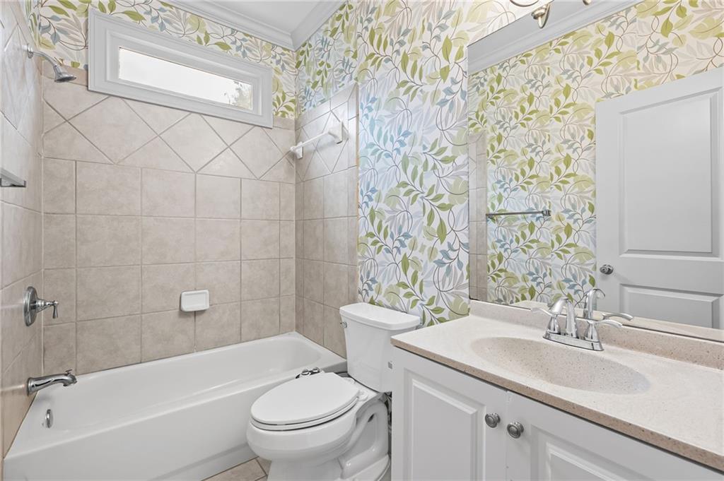 589 Lawton Bridge Road Southwest Smyrna, GA 30082 - Photo 22 of 52 a bathroom with a sink toilet and shower