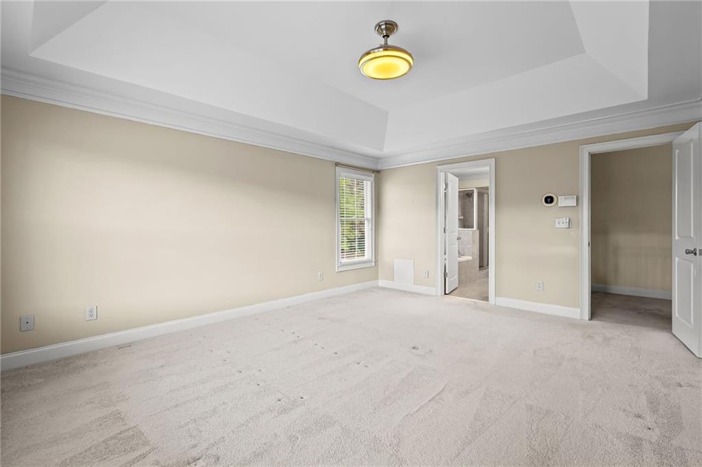 589 Lawton Bridge Road Southwest Smyrna, GA 30082 - Photo 27 of 52 an empty room with windows and closet