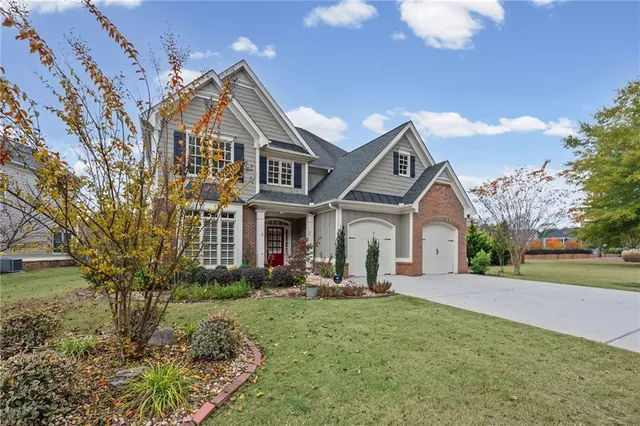 a front view of a house with a yard