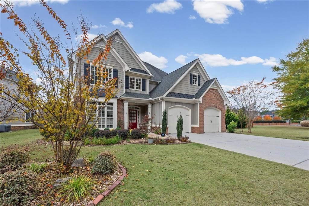 589 Lawton Bridge Road Southwest Smyrna, GA 30082 - Photo 3 of 52 a front view of a house with a yard