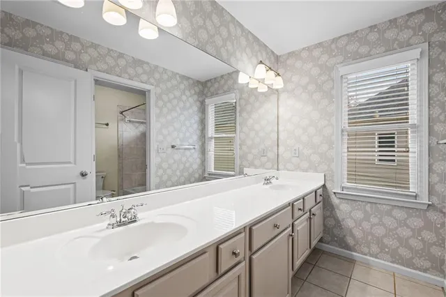 a bathroom with a toilet and shower