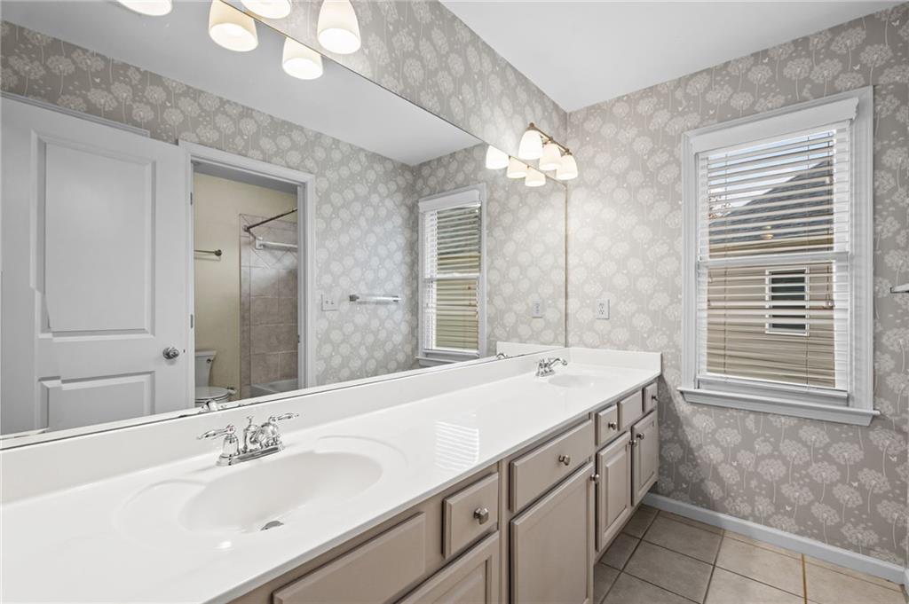 589 Lawton Bridge Road Southwest Smyrna, GA 30082 - Photo 38 of 52 a bathroom with a sink double vanity and a mirror