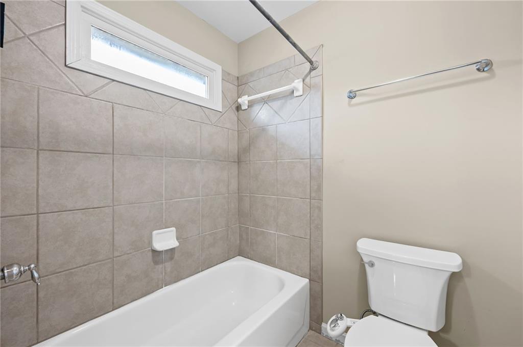 589 Lawton Bridge Road Southwest Smyrna, GA 30082 - Photo 39 of 52 a bathroom with a toilet and shower