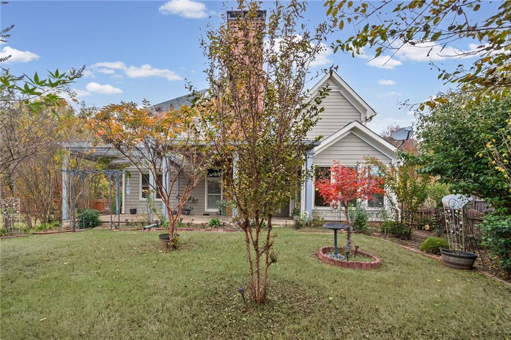 589 Lawton Bridge Road Southwest Smyrna, GA 30082 - Photo 45 of 52 a front view of a house with garden