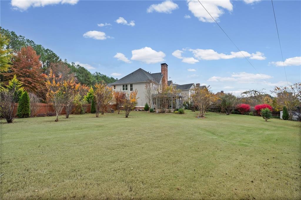 589 Lawton Bridge Road Southwest Smyrna, GA 30082 - Photo 48 of 52 a view of a big yard with table and chairs