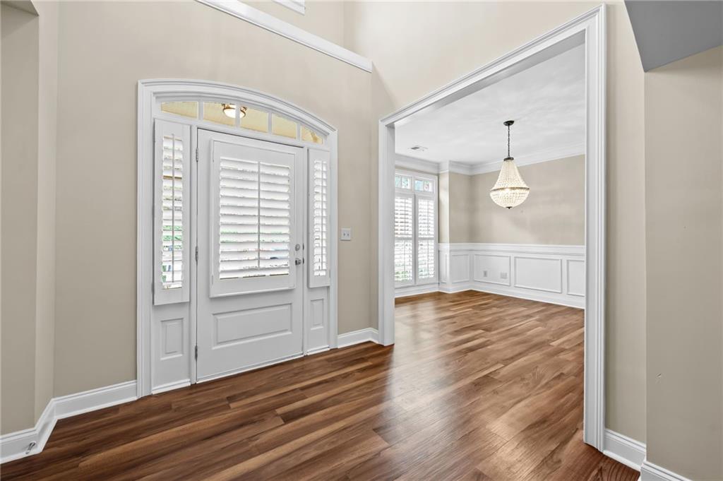 589 Lawton Bridge Road Southwest Smyrna, GA 30082 - Photo 5 of 52 a view of empty room with wooden floor and fan