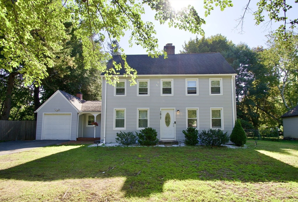 1617 Plumtree Road Springfield, MA 01119 - Photo 1 of 1 a front view of a house with a garden