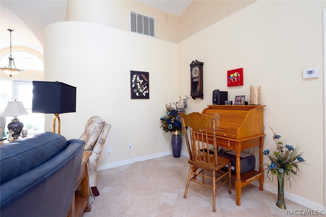 800 Balmoral Court Inverness, FL 34453 - Photo 8 of 72 a view of a livingroom with furniture and a potted plant