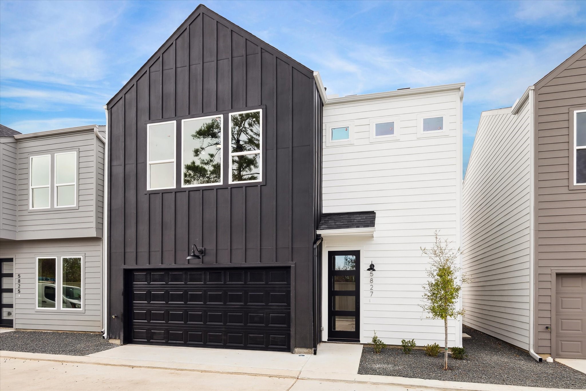 a front view of a house with a garage