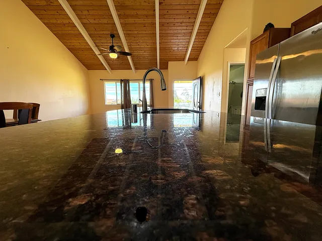 a kitchen with granite countertop lots of counter top space