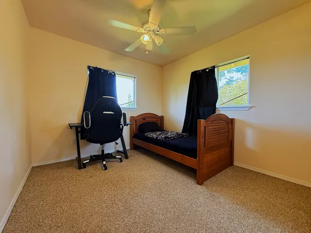 a view of entryway and hall with a wooden floor