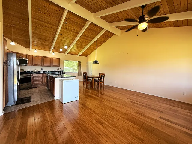 a view of a kitchen with microwave and stove