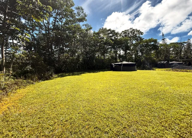a view of a swimming pool with an outdoor space and seating area