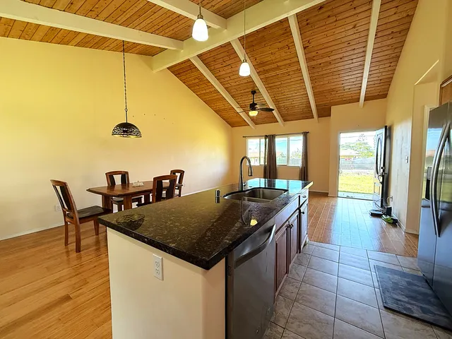 a kitchen with a table and chairs