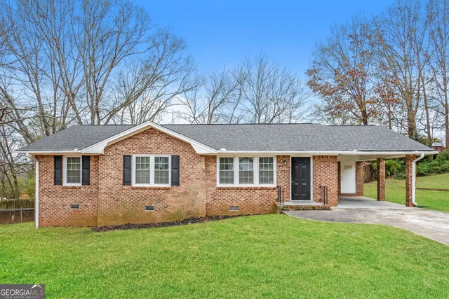 front view of a house with a yard