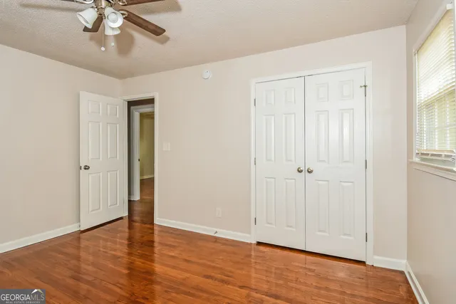 a bathroom with a sink toilet and mirror