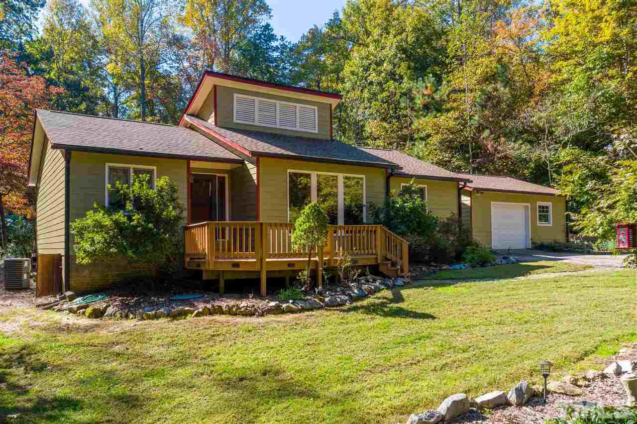 5901 Crabapple Road Durham, NC 27712 - Photo 2 of 20 a view of a house with yard and sitting area