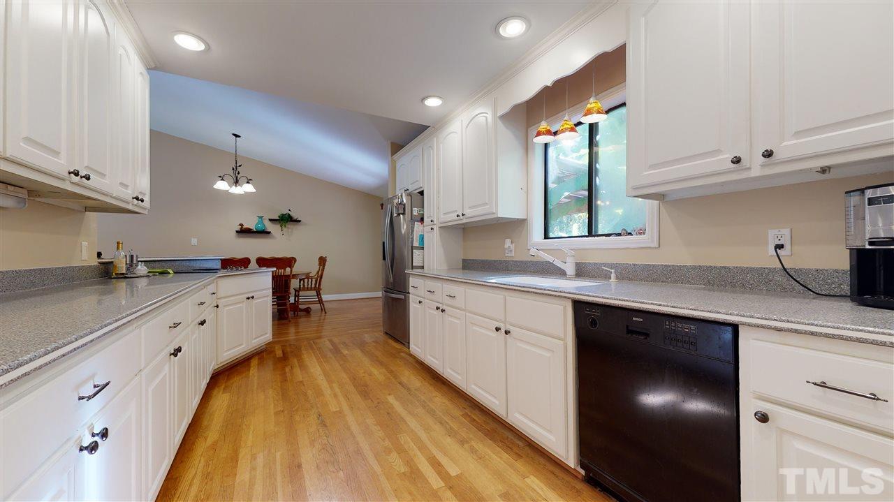 5901 Crabapple Road Durham, NC 27712 - Photo 13 of 20 a large kitchen with a lot of counter space and a sink