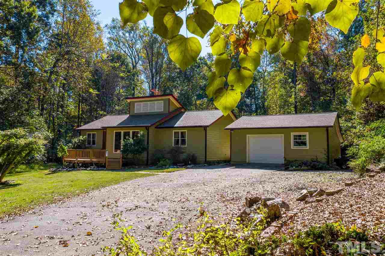 5901 Crabapple Road Durham, NC 27712 - Photo 20 of 20 a front view of house with yard and trees