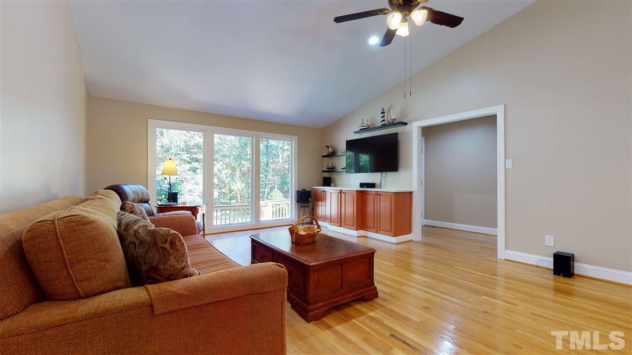 5901 Crabapple Road Durham, NC 27712 - Photo 7 of 20 a living room with furniture and a large window