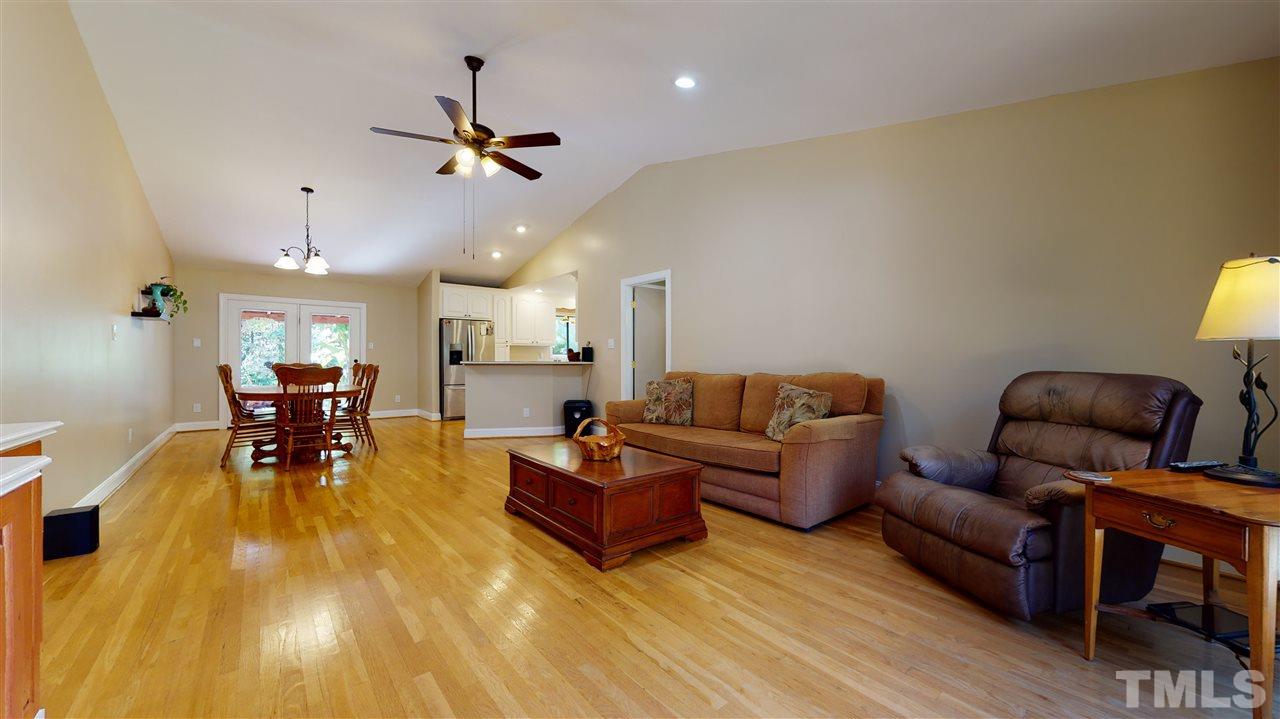 5901 Crabapple Road Durham, NC 27712 - Photo 8 of 20 a living room with furniture and wooden floor