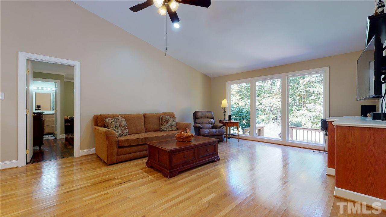5901 Crabapple Road Durham, NC 27712 - Photo 9 of 20 a living room with furniture and a large window