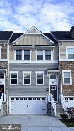 a front view of a house with glass windows