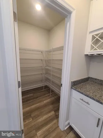 a stove top oven sitting inside of a kitchen