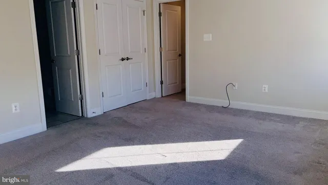 a white toilet sitting next to a sink