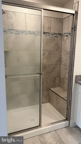 a view of a house with wooden deck