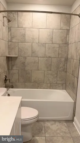 a view of a swimming pool with a lounge chair