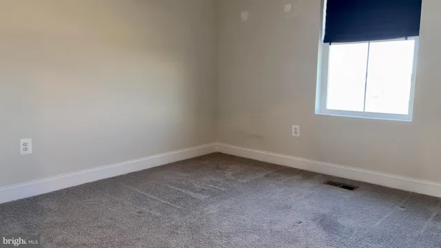 a view of a balcony with wooden floor