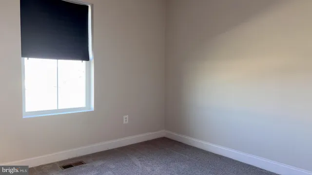 a view of a house with a garden and deck