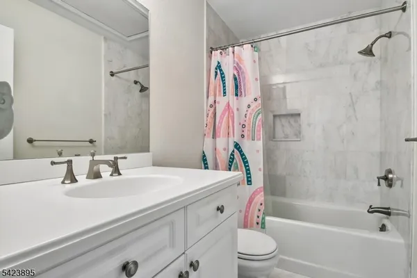 a bathroom with a sink a toilet and a bathtub