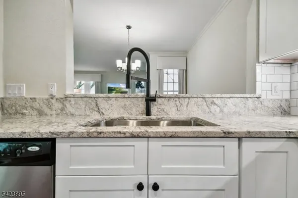 a bathroom with sink and mirror