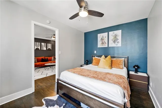 a bedroom with a bed and a chandelier