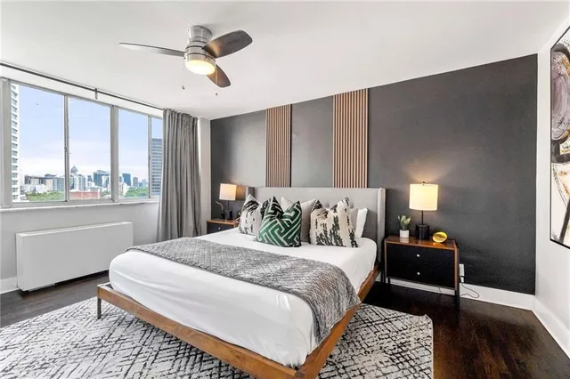 a bedroom with a bed and window