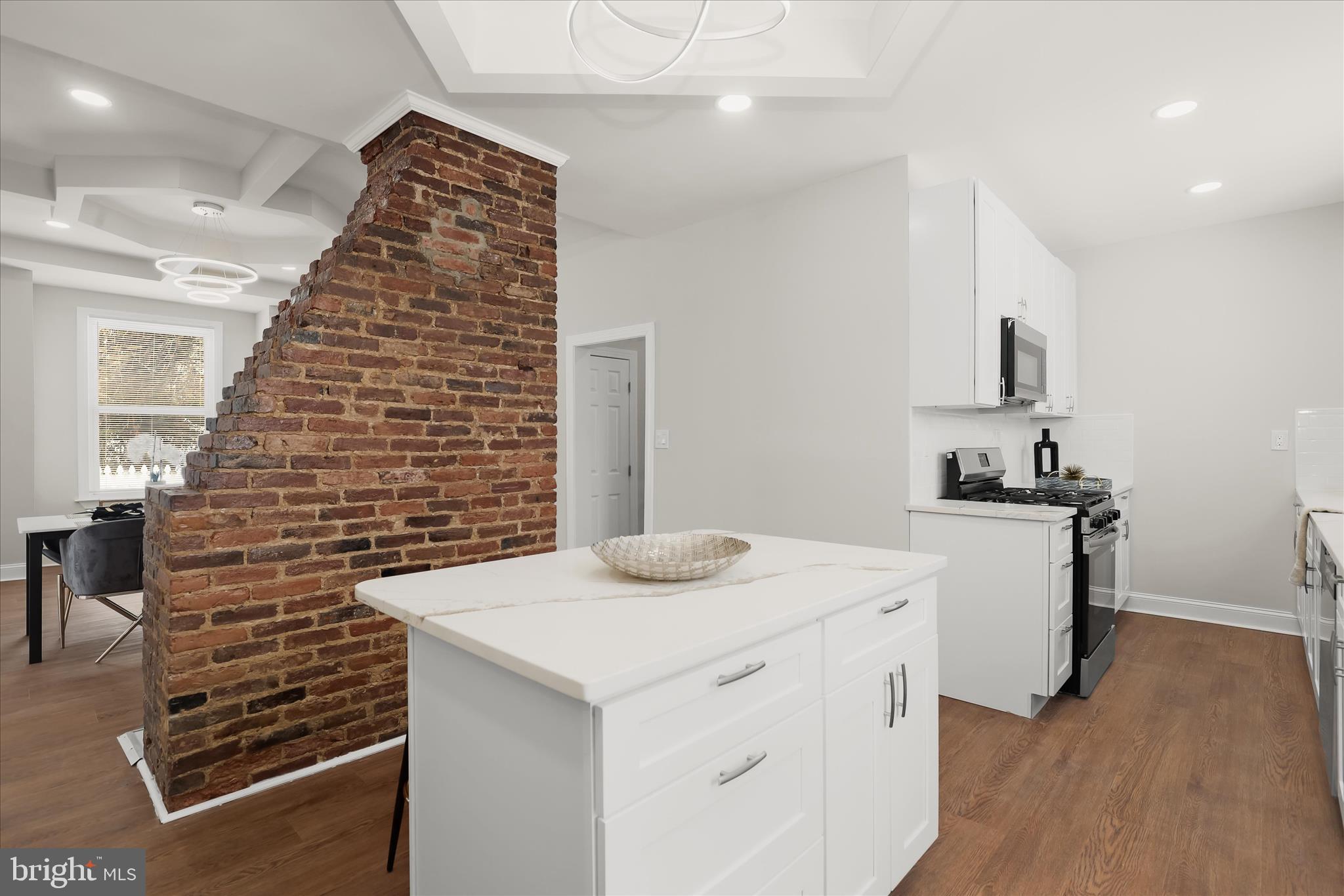 701 East 43rd Street Baltimore, MD 21212 - Photo 12 of 47 a kitchen that has a sink and a stove in it