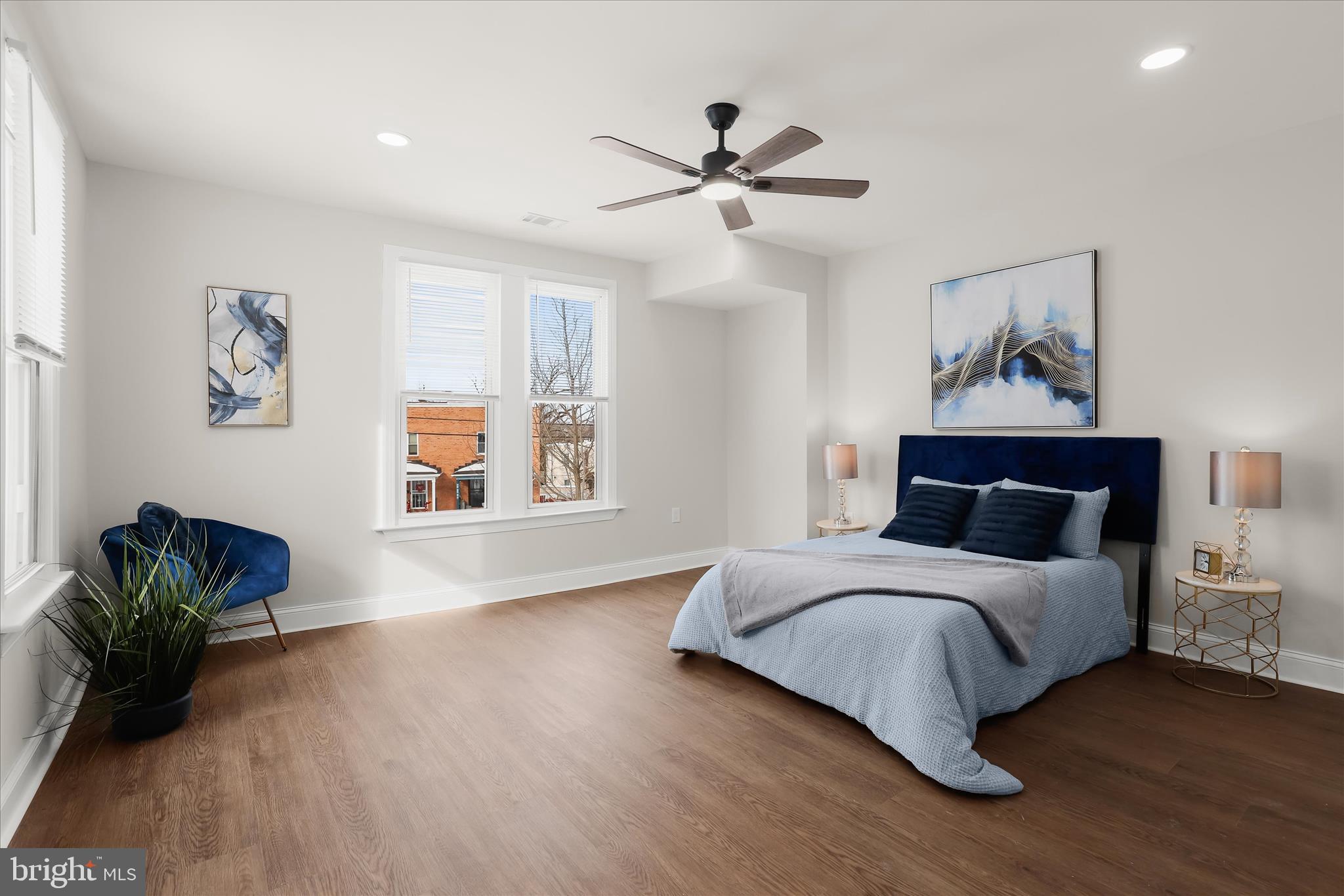 701 East 43rd Street Baltimore, MD 21212 - Photo 25 of 47 a bedroom with a bed and wooden floor