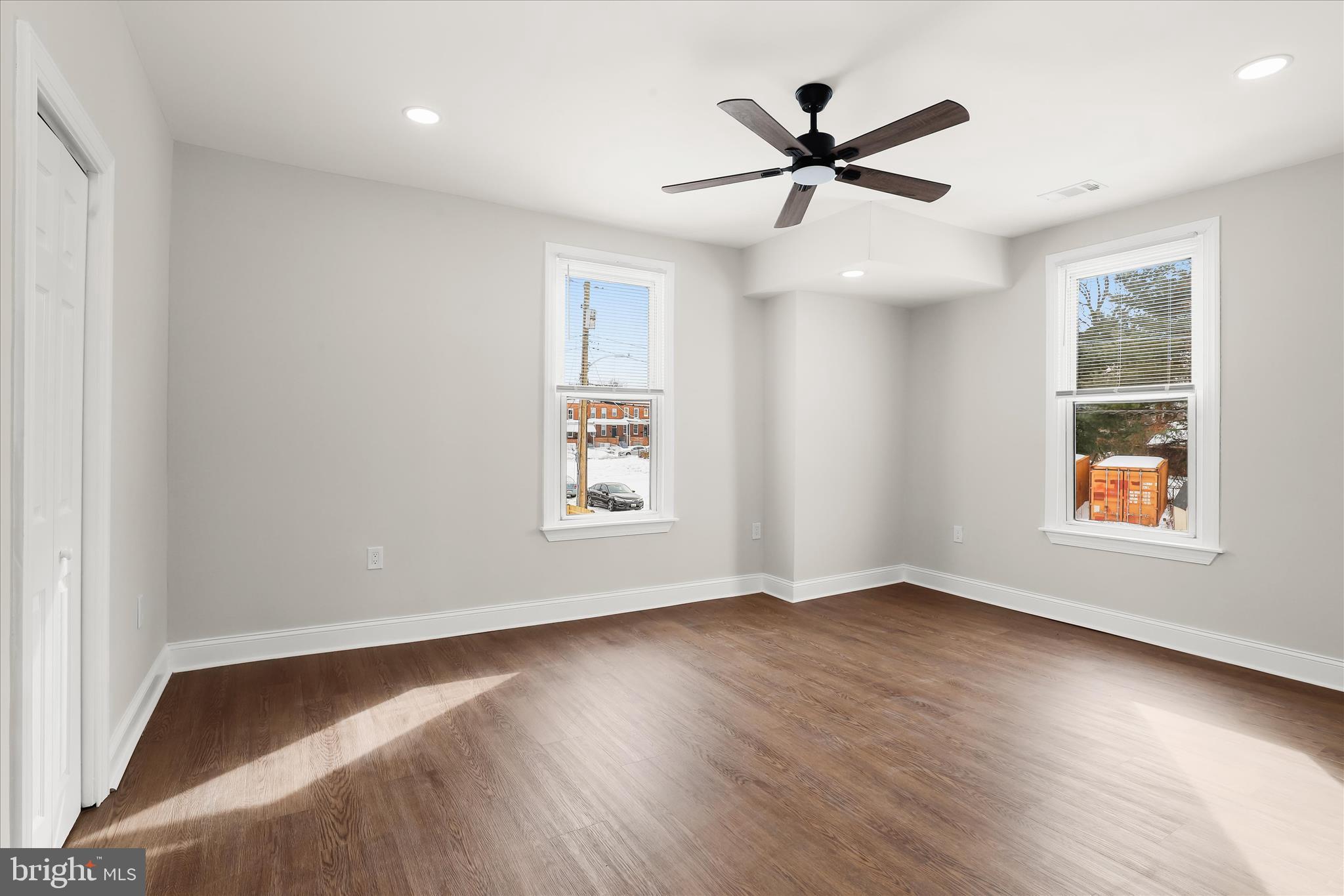 701 East 43rd Street Baltimore, MD 21212 - Photo 29 of 47 an empty room with wooden floor and windows