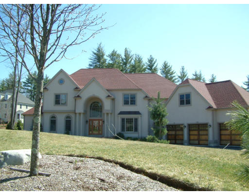 4 Shady Lane Walpole, MA 02081 - Photo 1 of 25 a front view of a house with a yard