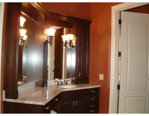 4 Shady Lane Walpole, MA 02081 - Photo 17 of 25 a bathroom with a double vanity sink and a mirror