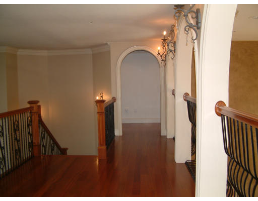 4 Shady Lane Walpole, MA 02081 - Photo 18 of 25 a view of a hallway with wooden floor and stairs