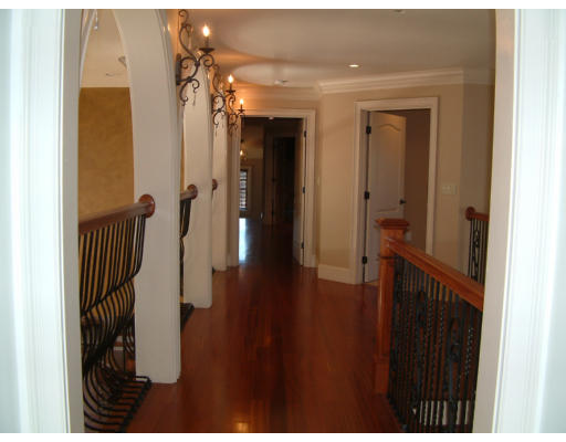 4 Shady Lane Walpole, MA 02081 - Photo 21 of 25 a view of a hallway with wooden floor